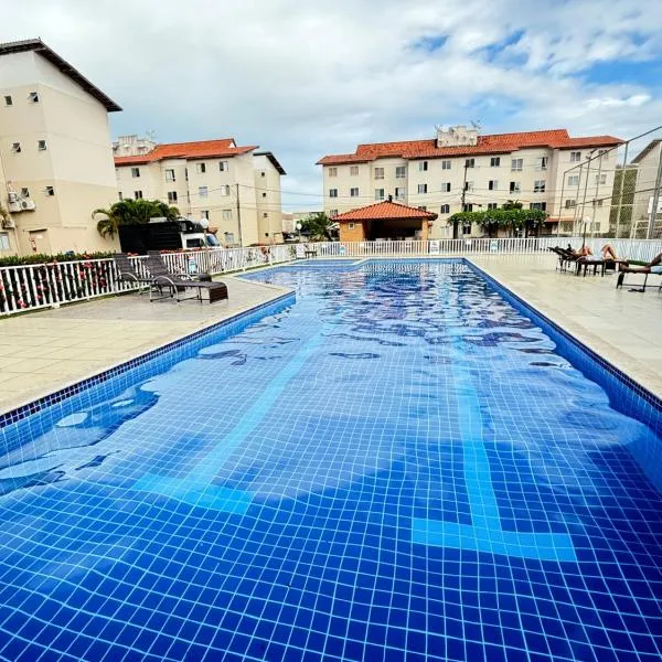 Apartamento 100 metros da praia com piscina，位于伊列乌斯的酒店