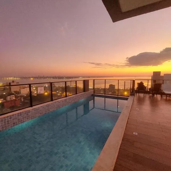 Modern apartment with pool, near Costanera beach，位于恩卡纳西翁的酒店