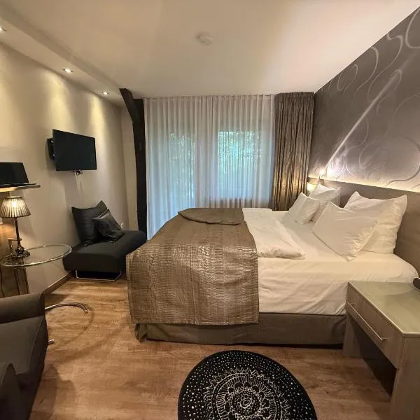 Hotel An der Wasserburg，位于沃尔夫斯堡的酒店