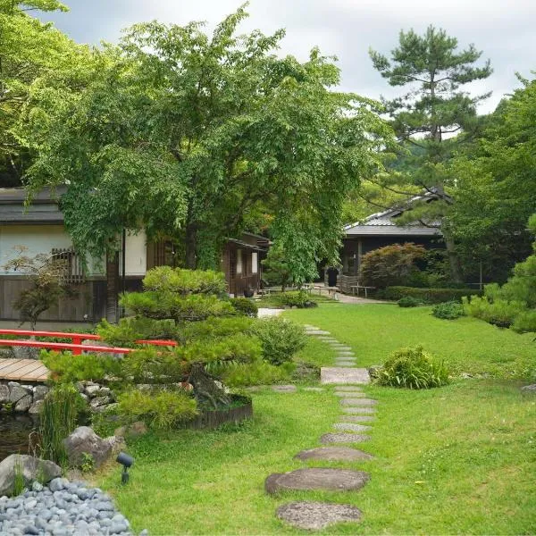 樱泉会馆，位于Izumi的酒店