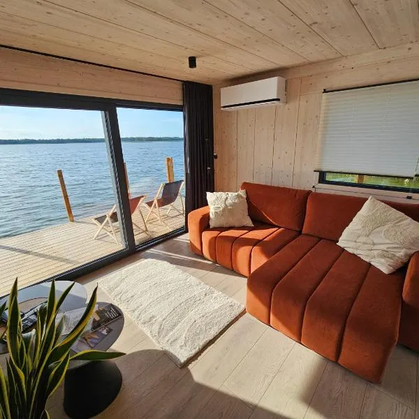 Domki na wodzie, Apartamenty, Houseboat, Jezioro Bukowo, Mierzeja "Natura Dąbkowice 5G"，位于达布基的酒店