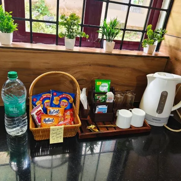 Harichandhanam Inn 200 meters from temple Ground floor，位于古鲁瓦尤尔的酒店