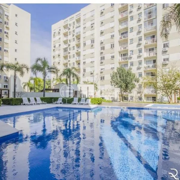 Apartamento suíte com estacionamento，位于阿雷格里港的酒店