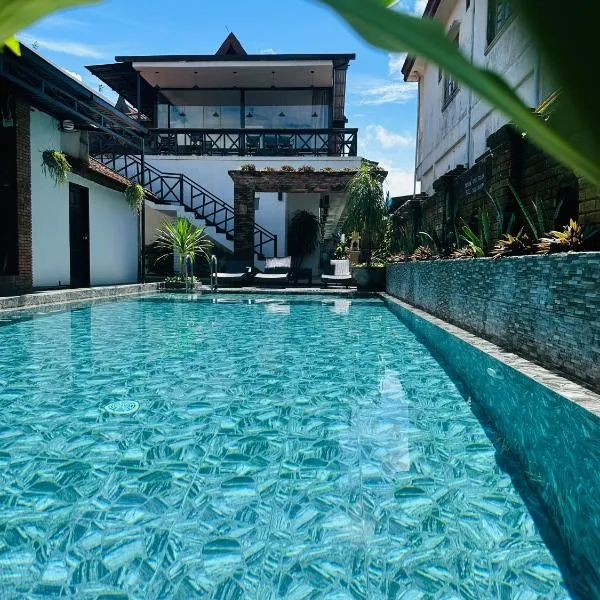 Win Hotel，位于万荣的酒店