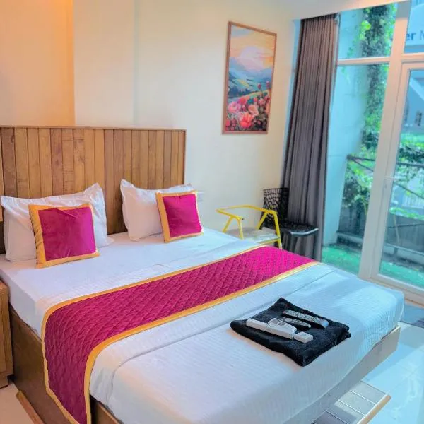 Rio Rooms Calicut Near Mims Hospital，位于科泽科德的酒店