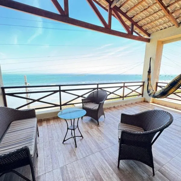 Casa da Maré Pé na areia Suítes climatizadas e deck vista mar，位于伊卡普伊的酒店