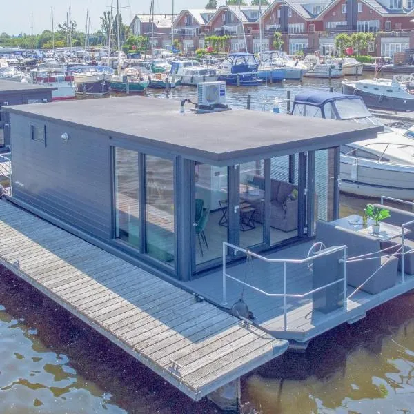 Tiny houseboat Parel I - airco，位于厄伊特海斯特的酒店