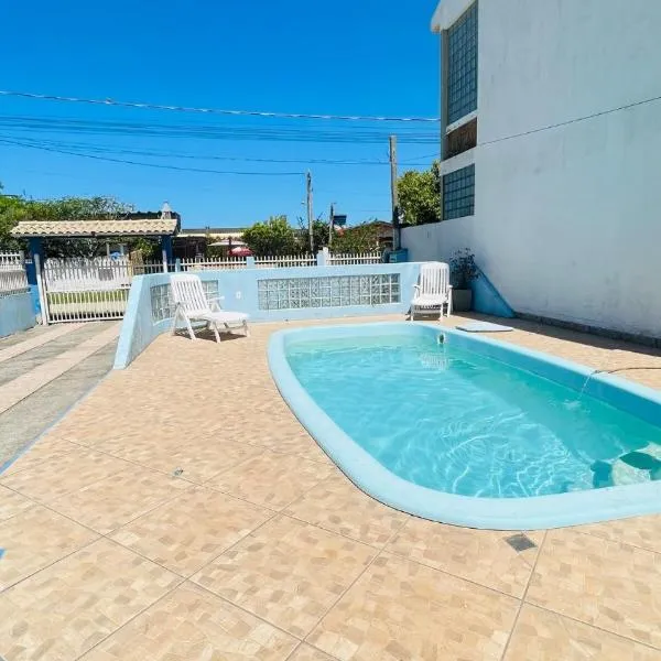 Casa com piscina próximo a praia，位于里奥格兰德的酒店