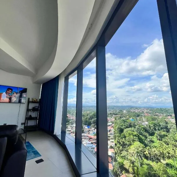 Minimalist 1BR Condo with NETFLIX at AEON TOWERS near Abreeza Mall by Rico，位于达沃市的酒店