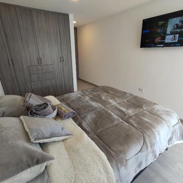 Apartamento Moderno en Las Quintas Ascensor Parking Ubicación Premium，位于通哈的酒店