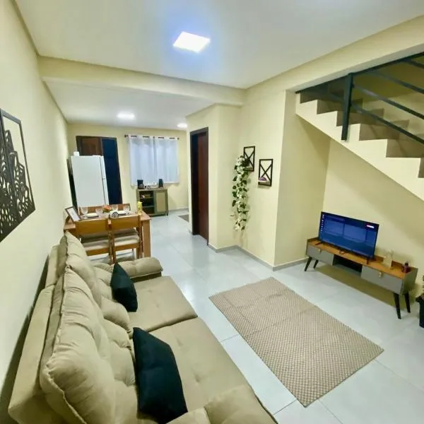 Casa completa com 2 quartos e garagem perto do aeroporto,位于约恩维利的酒店
