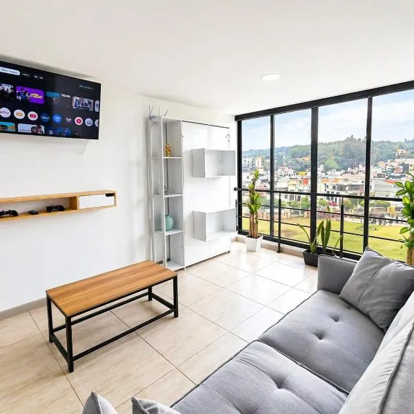 Apartamento amplio frente a Santo Tomás con parqueadero privado y wifi，位于通哈的酒店
