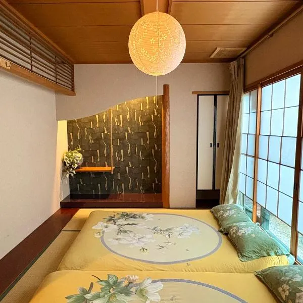 Just a short walk 心斎橋 Glico Sign 1min 道頓堀30-second 黒門市場 難波駅 Dotonbori Guesthouse 松の阁,位于大阪的酒店