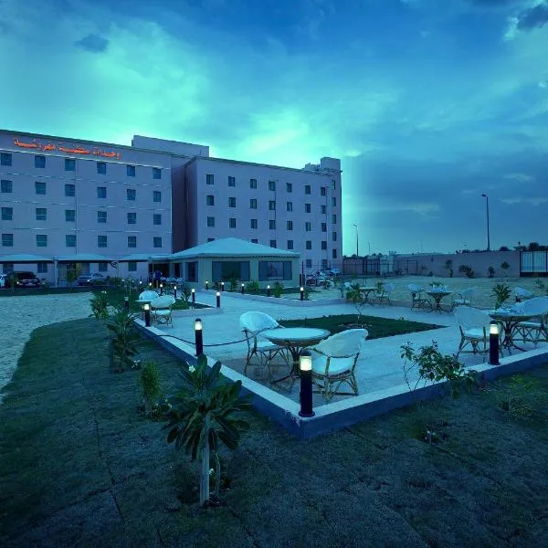 棕榈百合套房酒店，位于哈萨的酒店