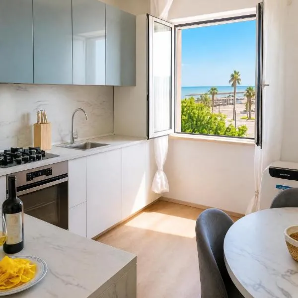 Bilocale Fronte Mare con Parcheggio & Spiaggia，位于波尔图圣乔治的酒店