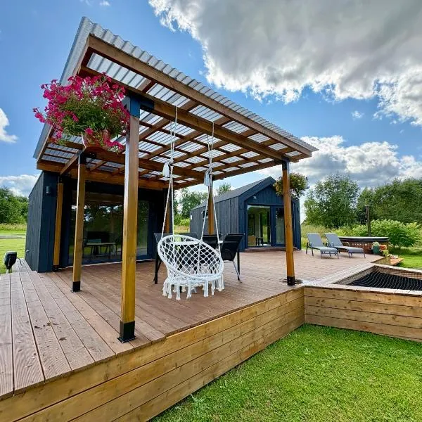 Rātes Krasti - Rasa - holiday house with sauna and lakeview，位于Lejasciems的酒店