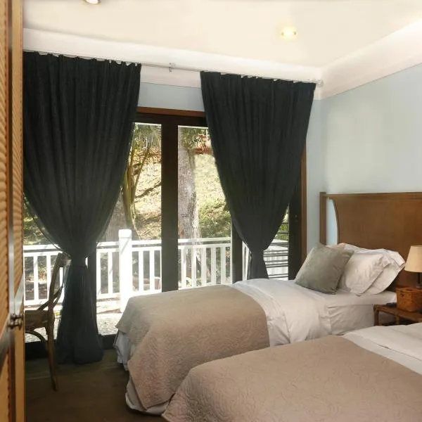 贝壳度假公寓式酒店，位于科罗尔村的酒店
